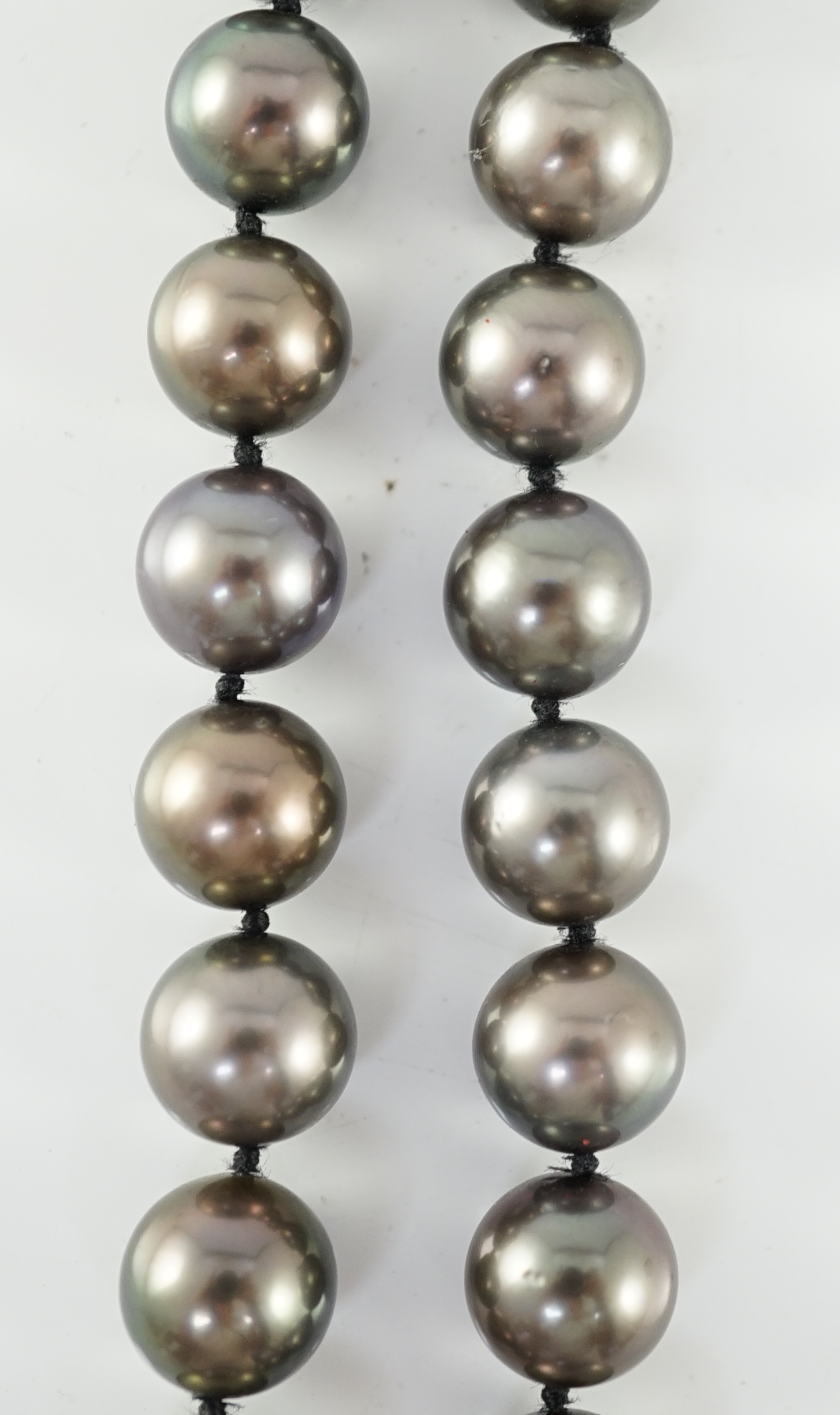 A modern Cartier single strand Tahitian pearl necklace, with 18ct gold and pave set diamond spherical clasp